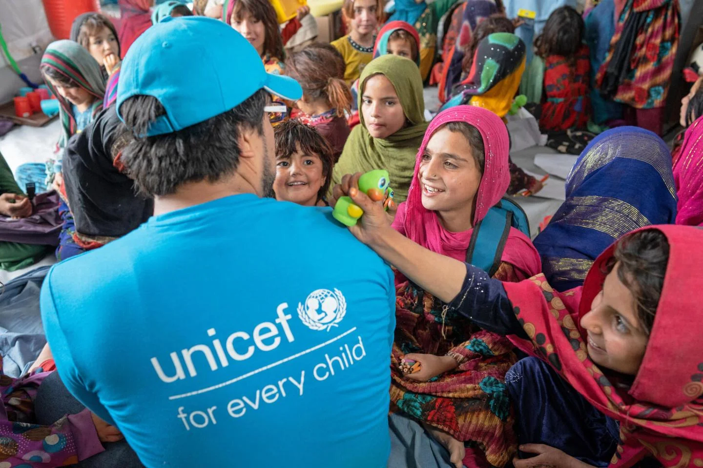 UNICEF volunteer with children